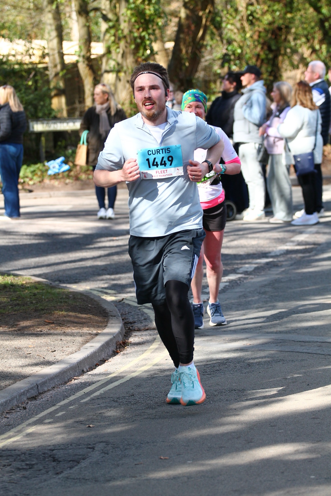 Half marathon runner pushing through the race with determination and energy.